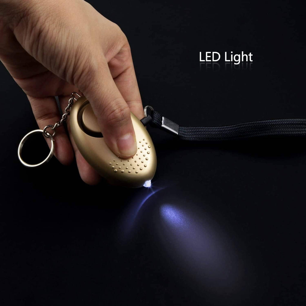 Gold personal security alarm fob with key ring, black lanyard, and LED light