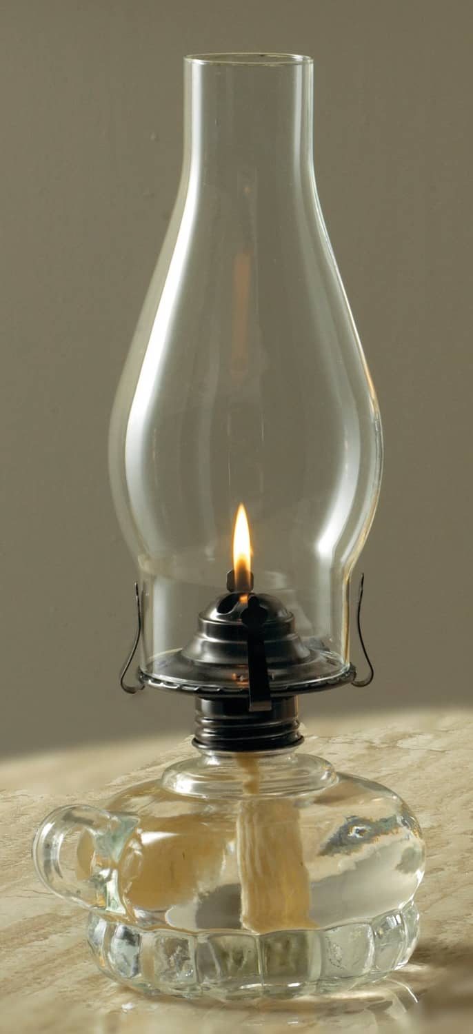 Glass oil lamp with visible flame, used with clear lamp oil