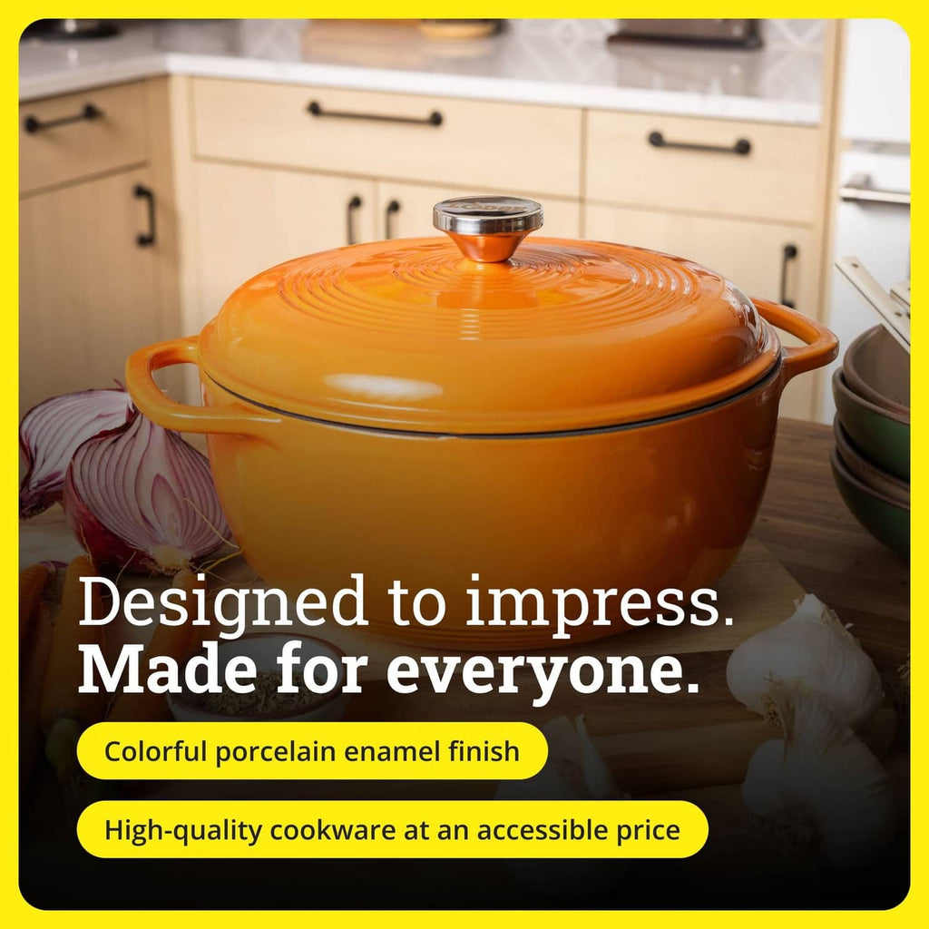 Pumpkin-orange enameled cast iron Dutch oven with lid on countertop