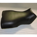 Black contoured ATV seat cover, smooth molded shape with side bolsters