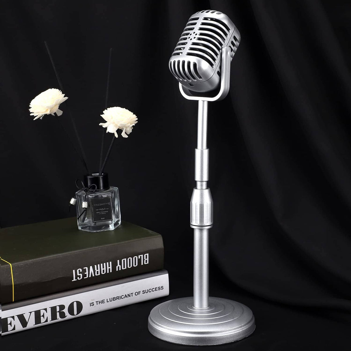 Silver vintage desktop microphone prop on round base with slim adjustable stand