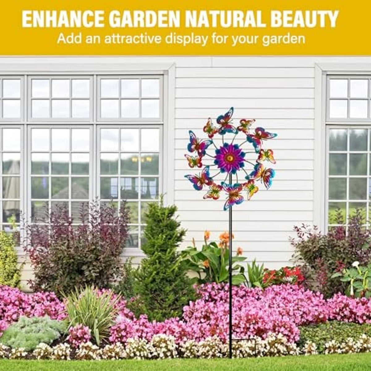 Butterfly garden wind spinner yard stake with colorful metal flower and butterflies near flowers