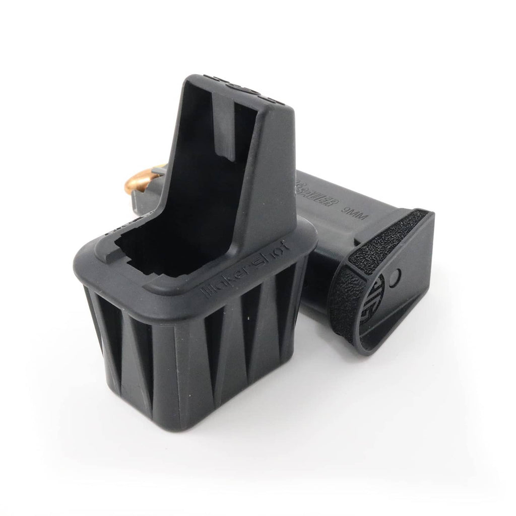 Black speed loader with textured grip and open top bay for brass rounds