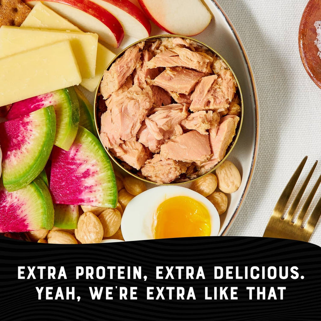 Albacore tuna serving bowl with egg, beans, and sliced radish and cucumber