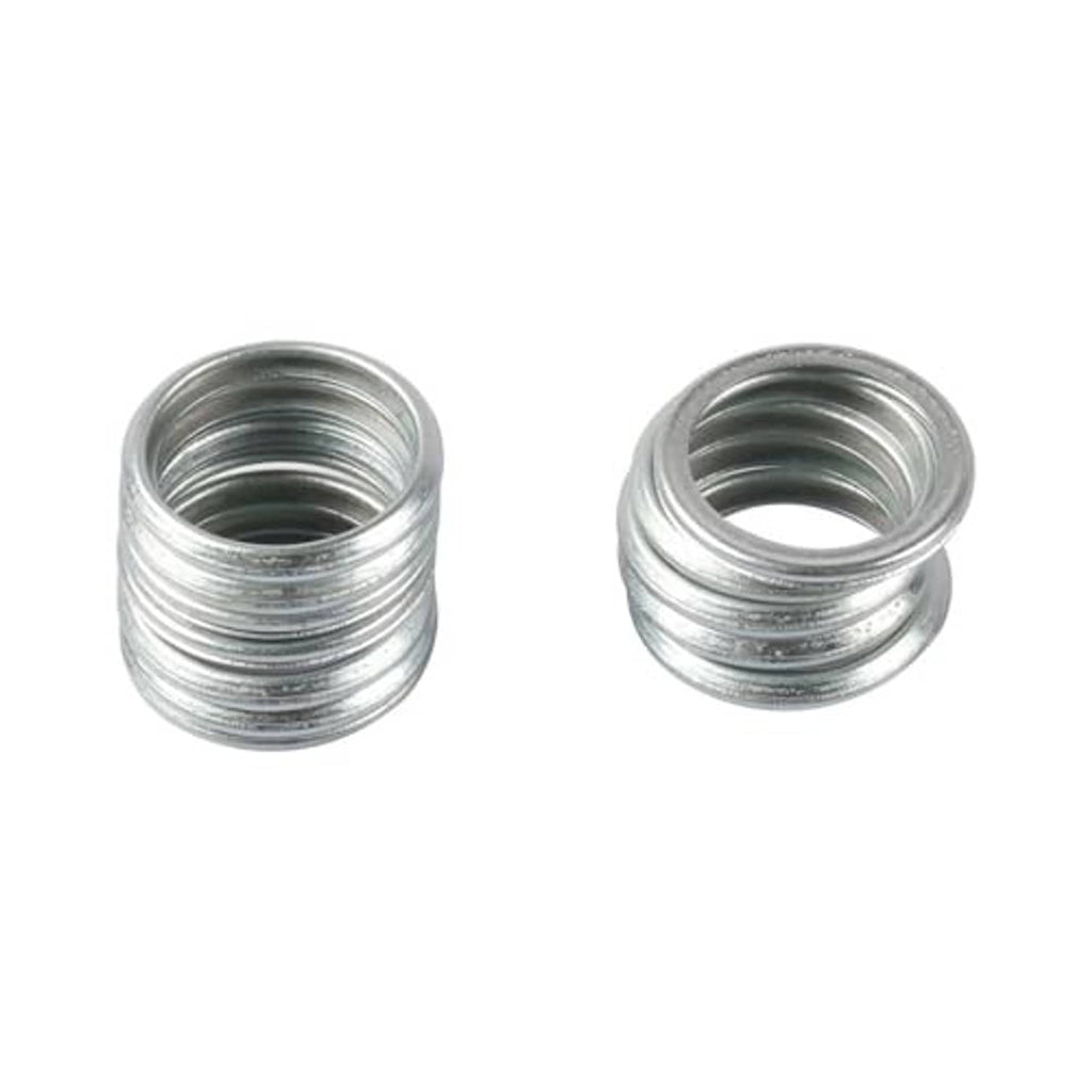 Oil drain plug gaskets close-up, silver metal crush washers, two stacked rings
