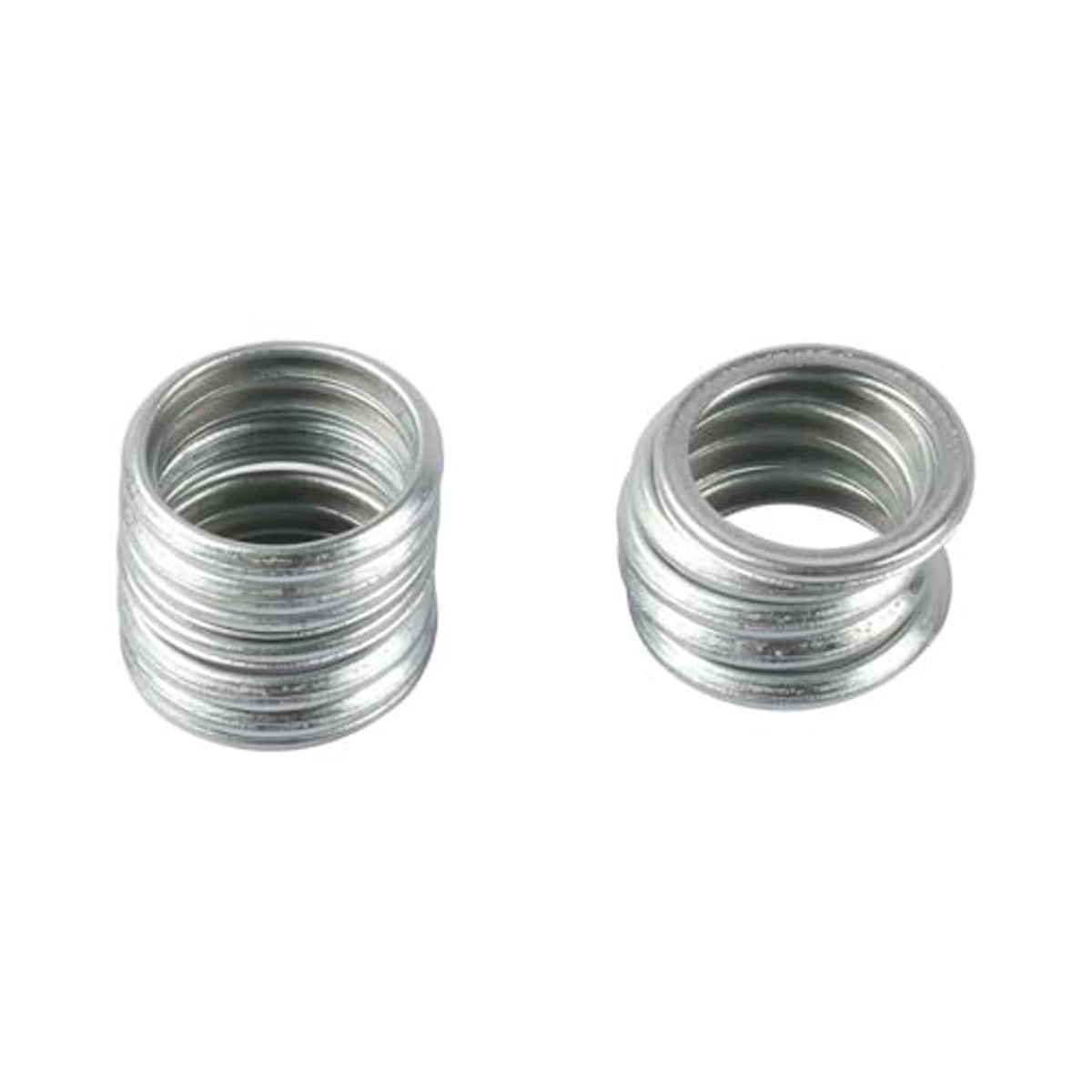 Oil drain plug gaskets close-up, silver metal crush washers, two stacked rings