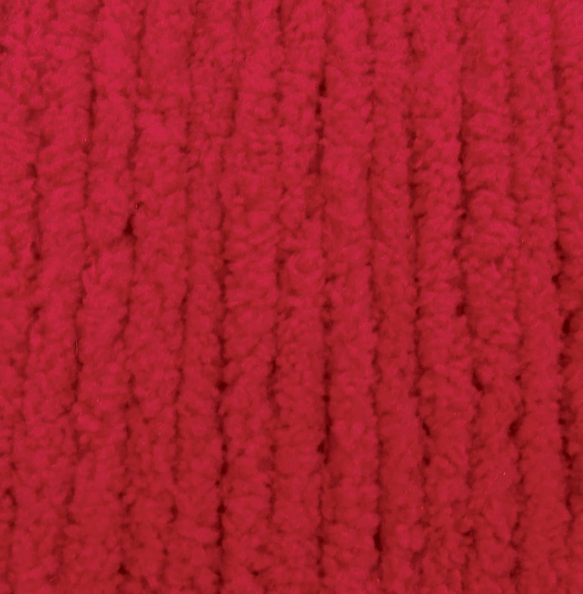 Race car red chenille yarn texture with thick, looped stitches
