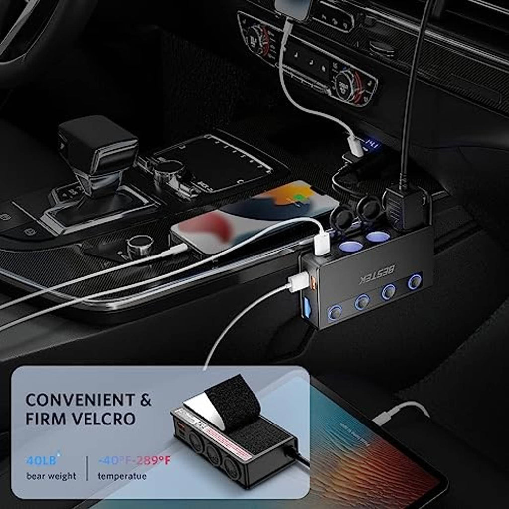 Black multi-port car charger splitter in vehicle console with connected cables and mounting pad.
