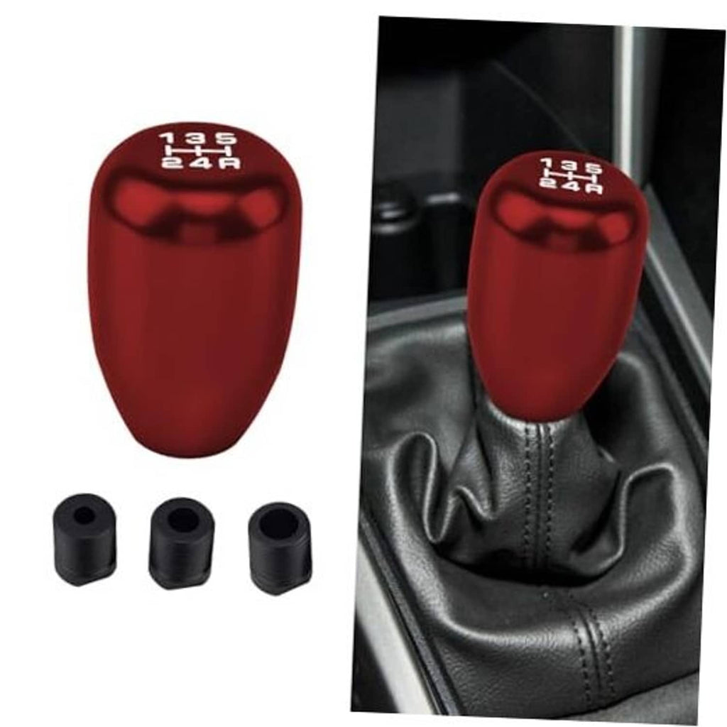 Red manual gear shift knob with top markings; includes three black adapters
