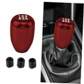 Red manual gear shift knob with top markings; includes three black adapters