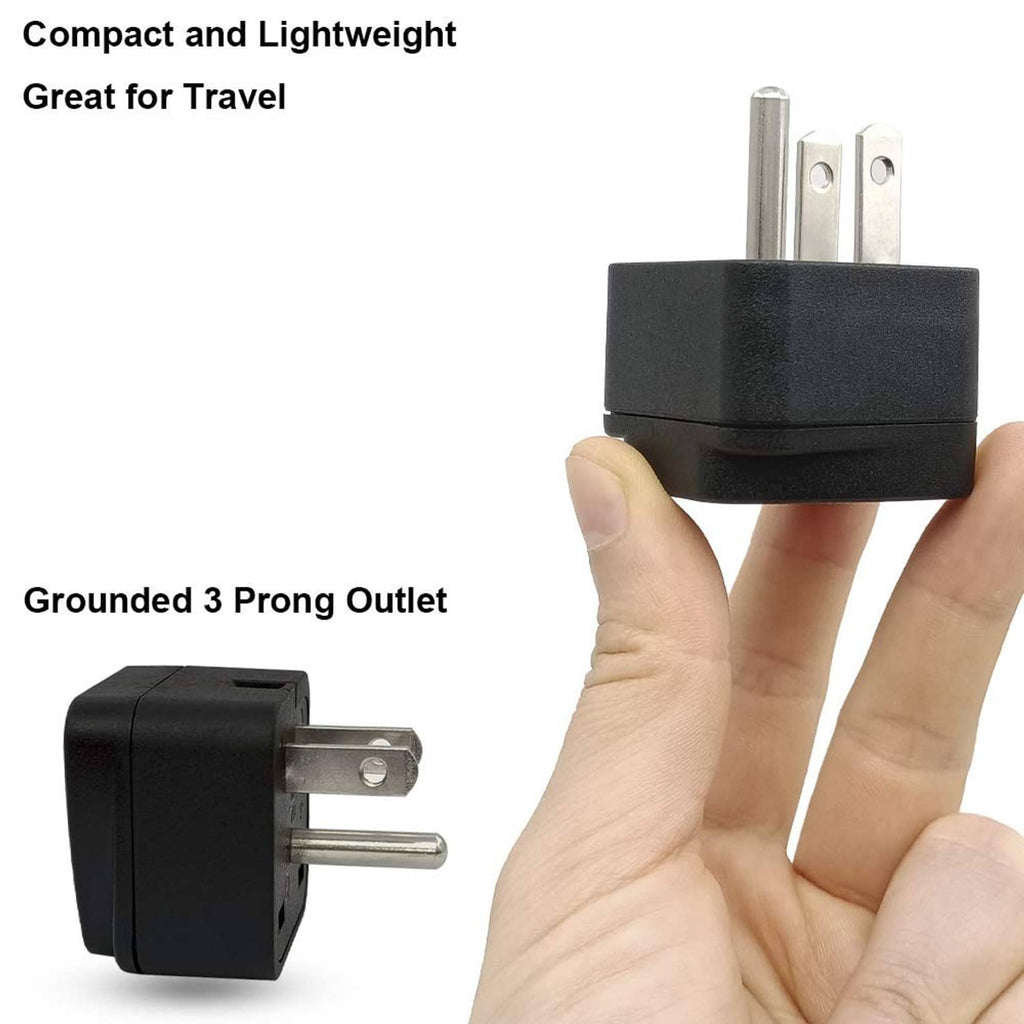 Black compact travel plug adapter held in hand with grounded three-pin design