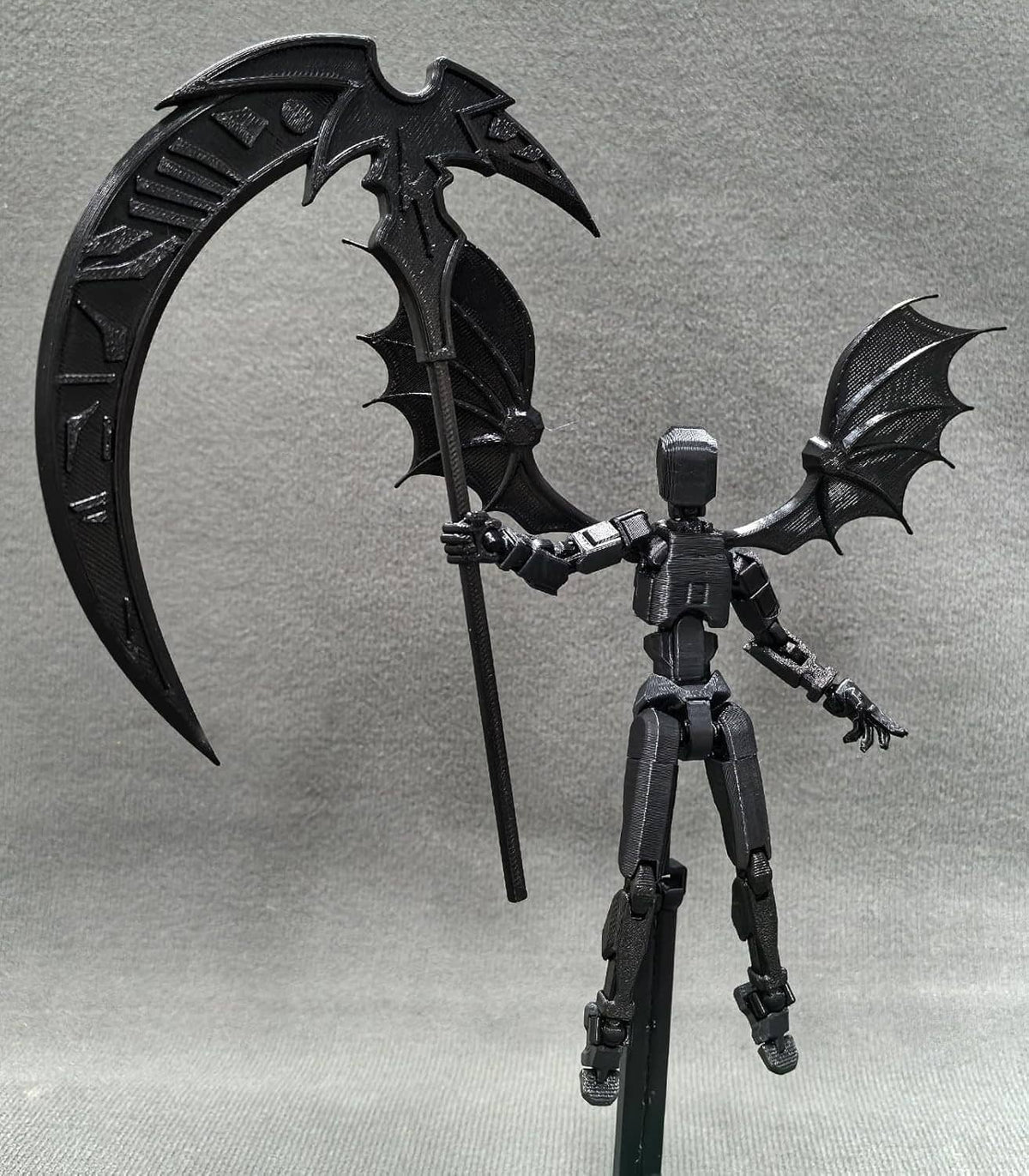 Titan 13 robot action figure with bat wings holding a staff-like sword