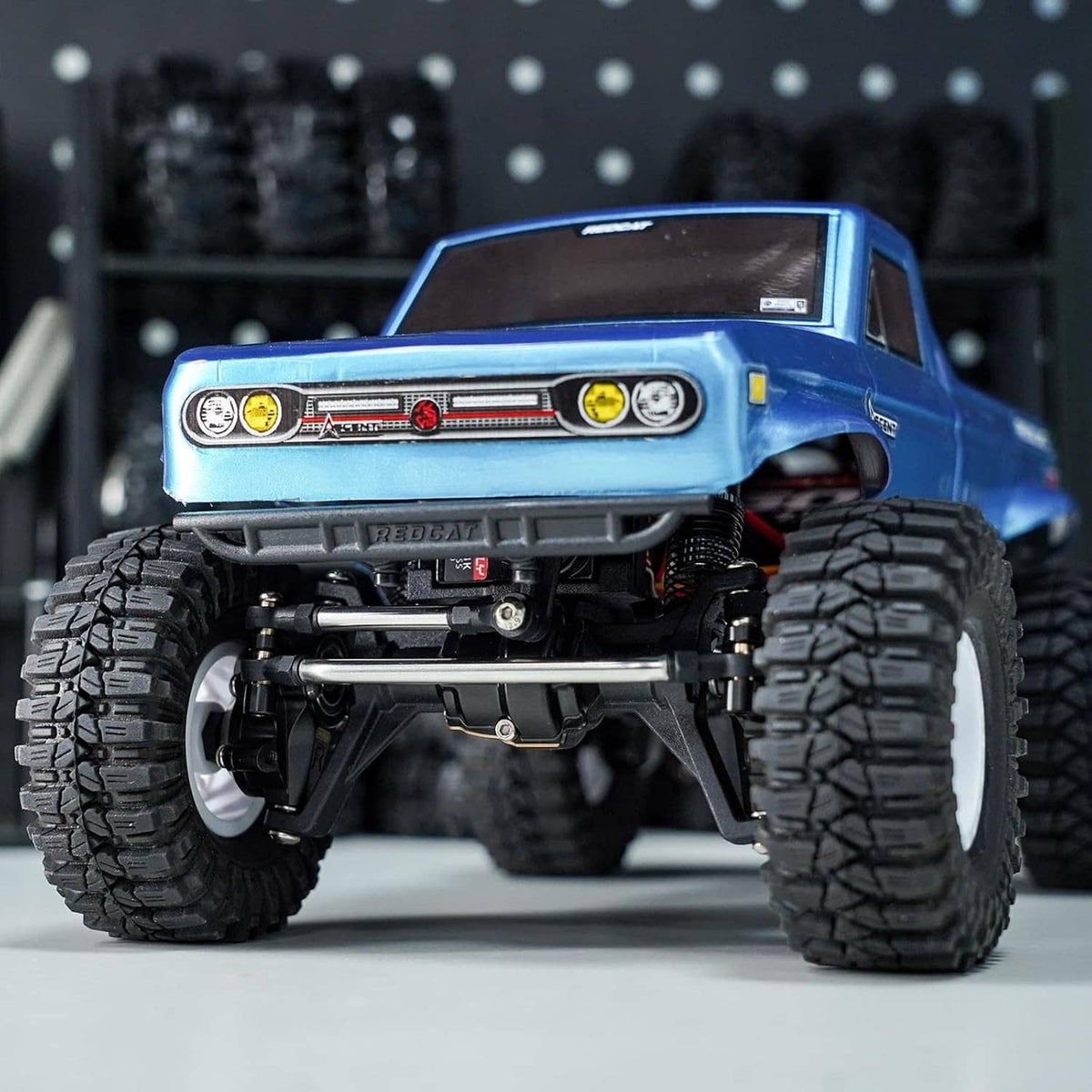 Stainless steel steering links installed under a 1/18 RC crawler chassis, front view
