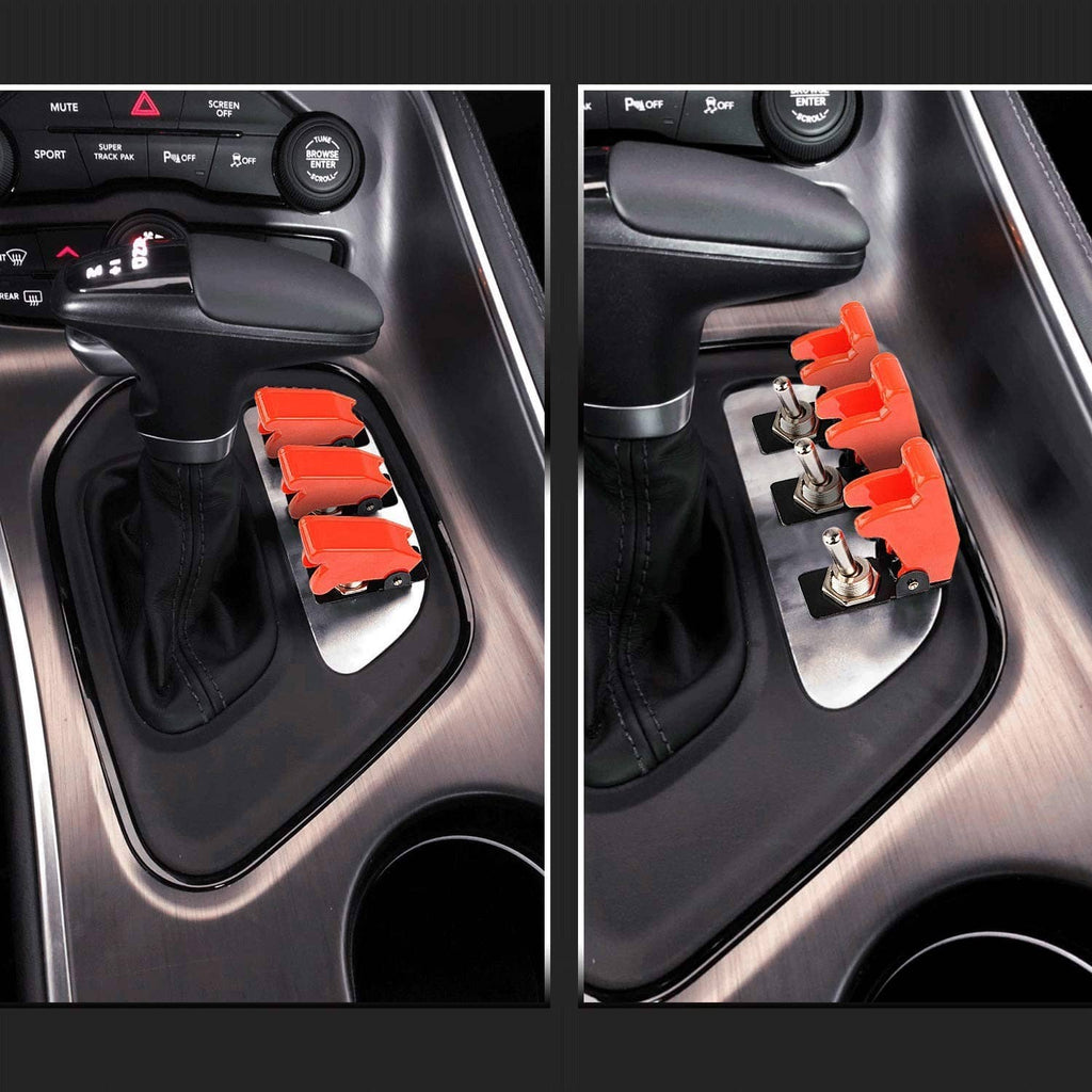Red rocker toggle switch installed in car console, with black base and terminals