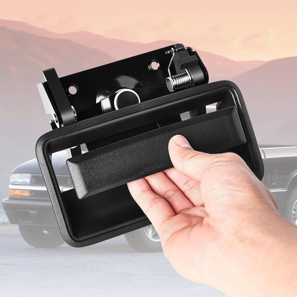 Black tailgate handle and latch bezel with spring-loaded mechanism