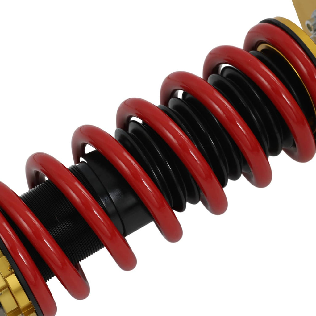 Coilover spring assembly with red coils over black adjustment sleeves