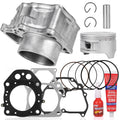 Engine rebuild kit with silver cylinder, piston, piston rings, gaskets, and red sealant tube