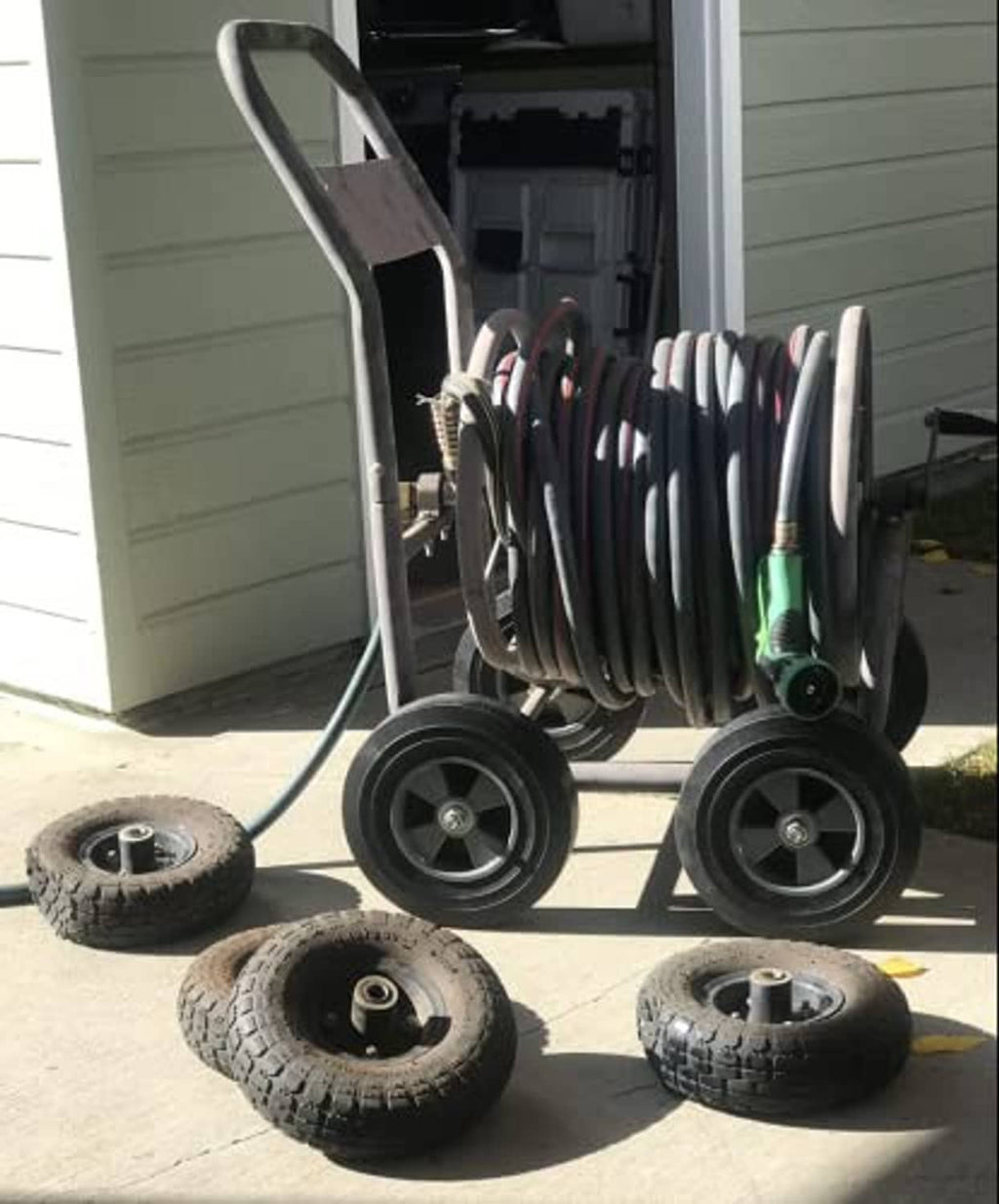 Solid rubber hand truck wheels with black tires and silver metal hubs