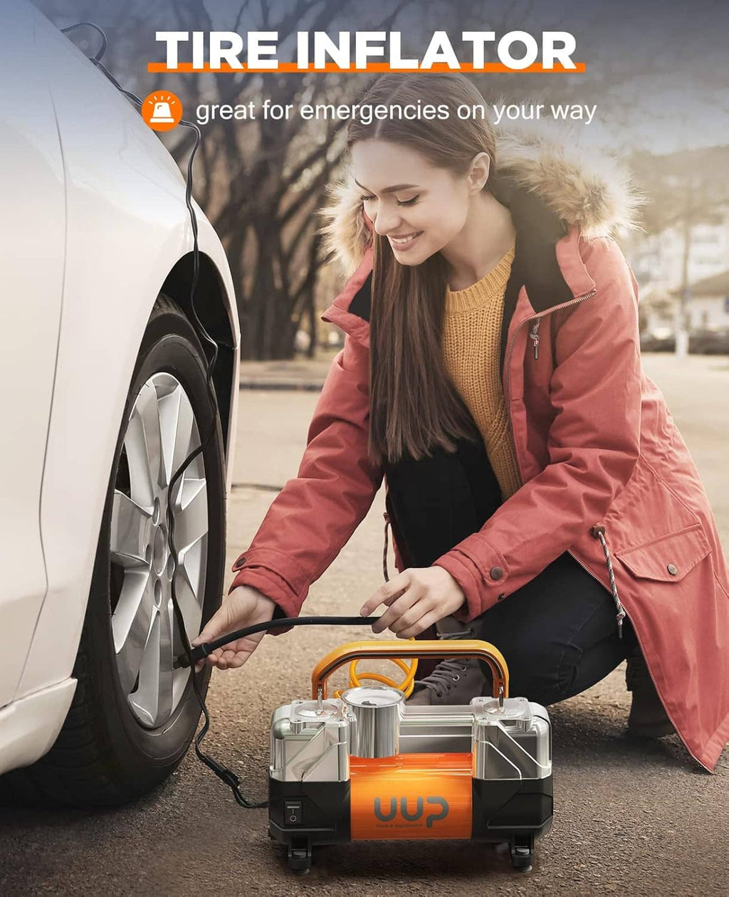 12V portable tire inflator next to a parked car with hose and nozzle attached
