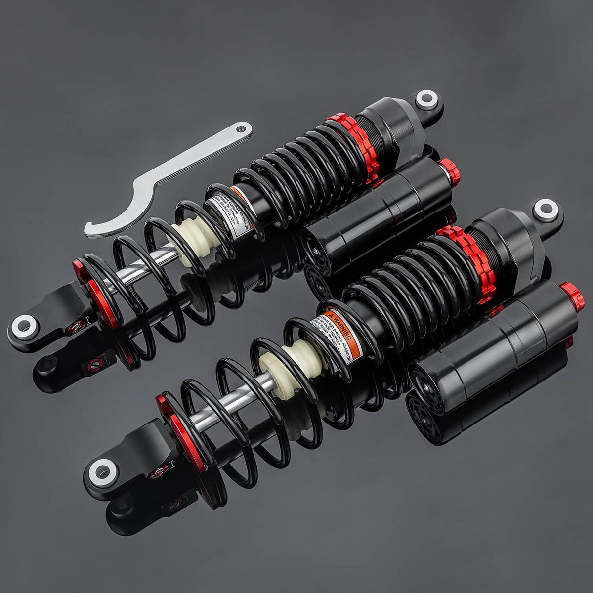 Front air shock suspension set showing two paired shocks with black bodies, red rings, springs