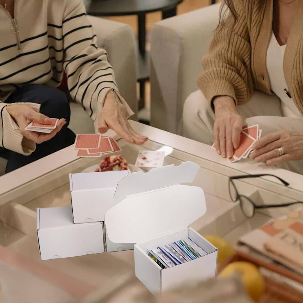 White cardboard card storage boxes on table for card sorting during gameplay