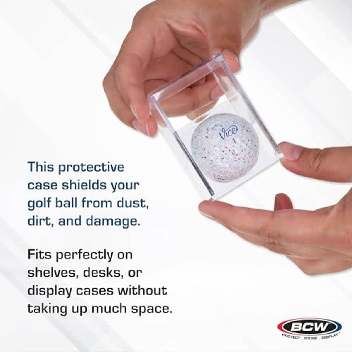 Clear protective golf ball holder cube being placed over a golf ball