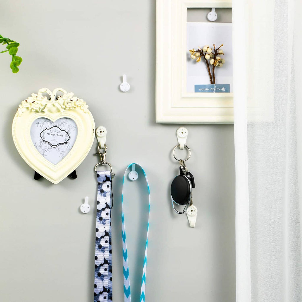 White plastic wall hanger hooks with key rings and hanging loops