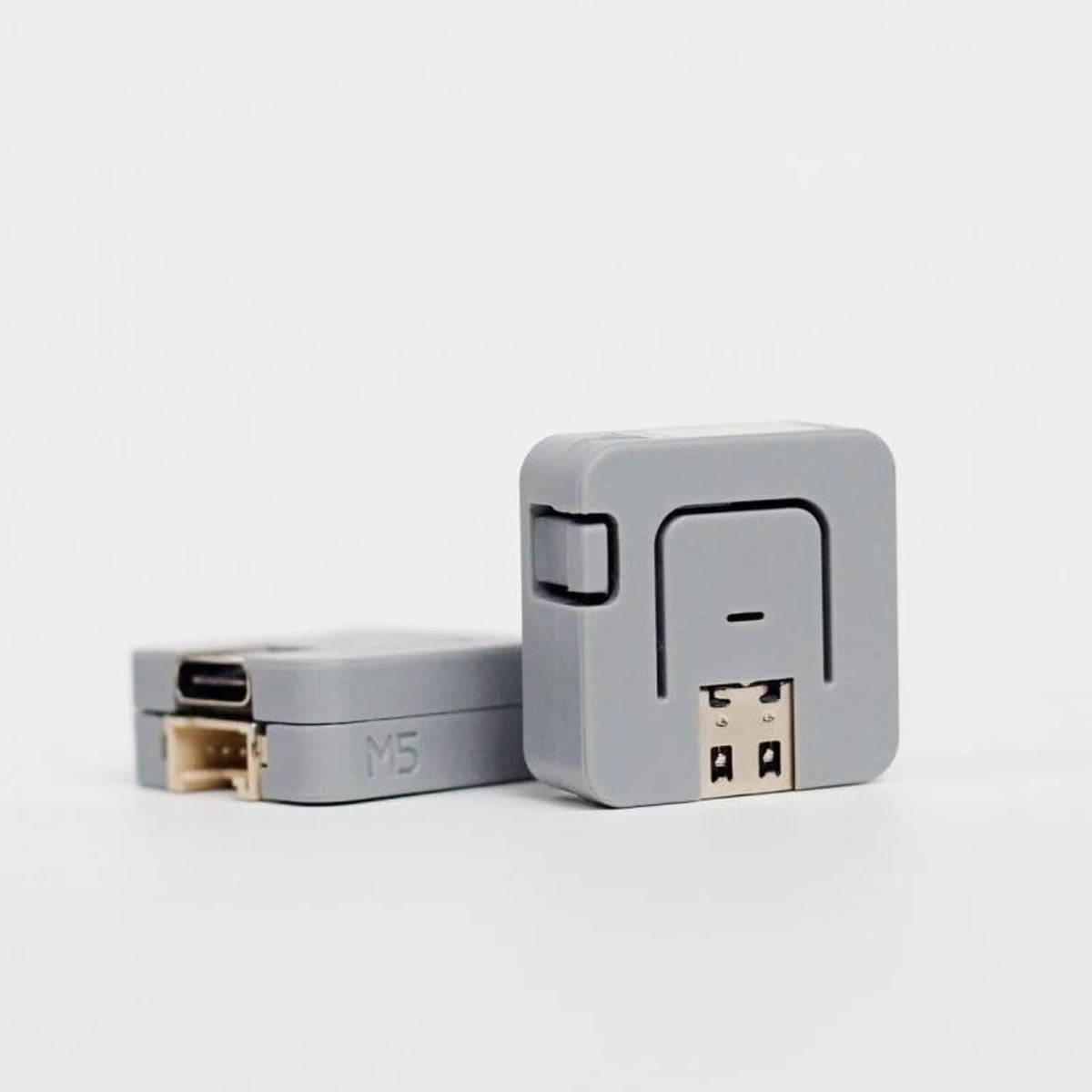 Grey ATOM Lite ESP32 module side view with connector terminals and slot
