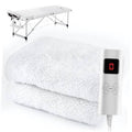 White heated massage table pad with attached control panel and LED temperature display.