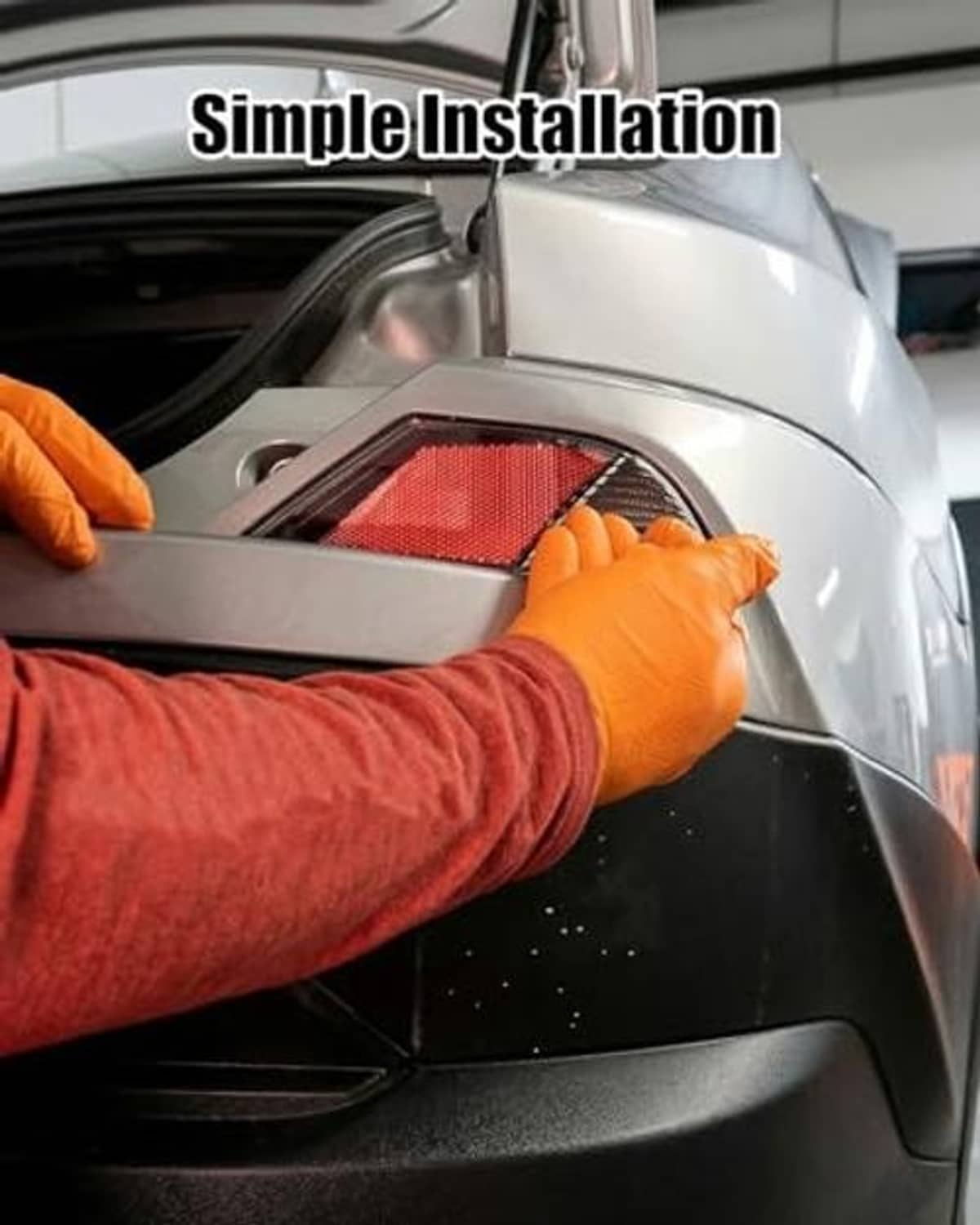 Rear reflector lamp being installed into a vehicle opening, red lens with white housing