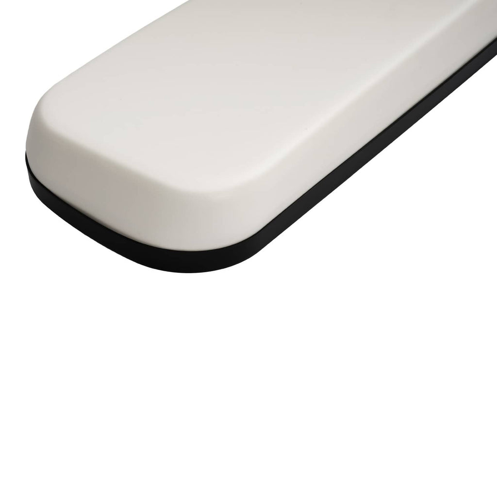 White seat cushion with rounded corners and black border trim