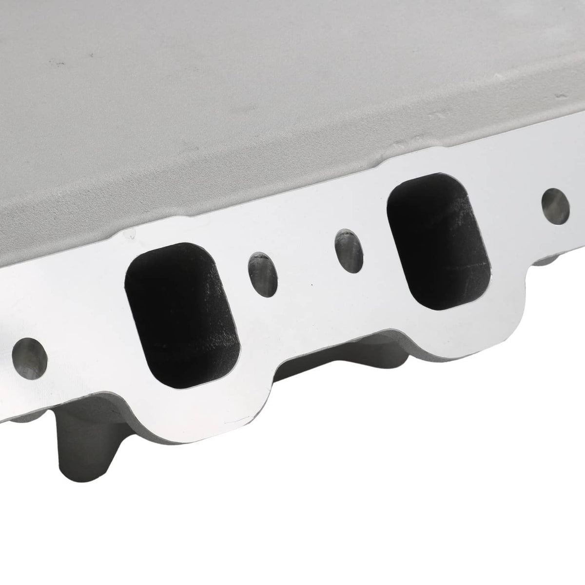 Engine intake manifold gasket surface with black port openings and bolt holes