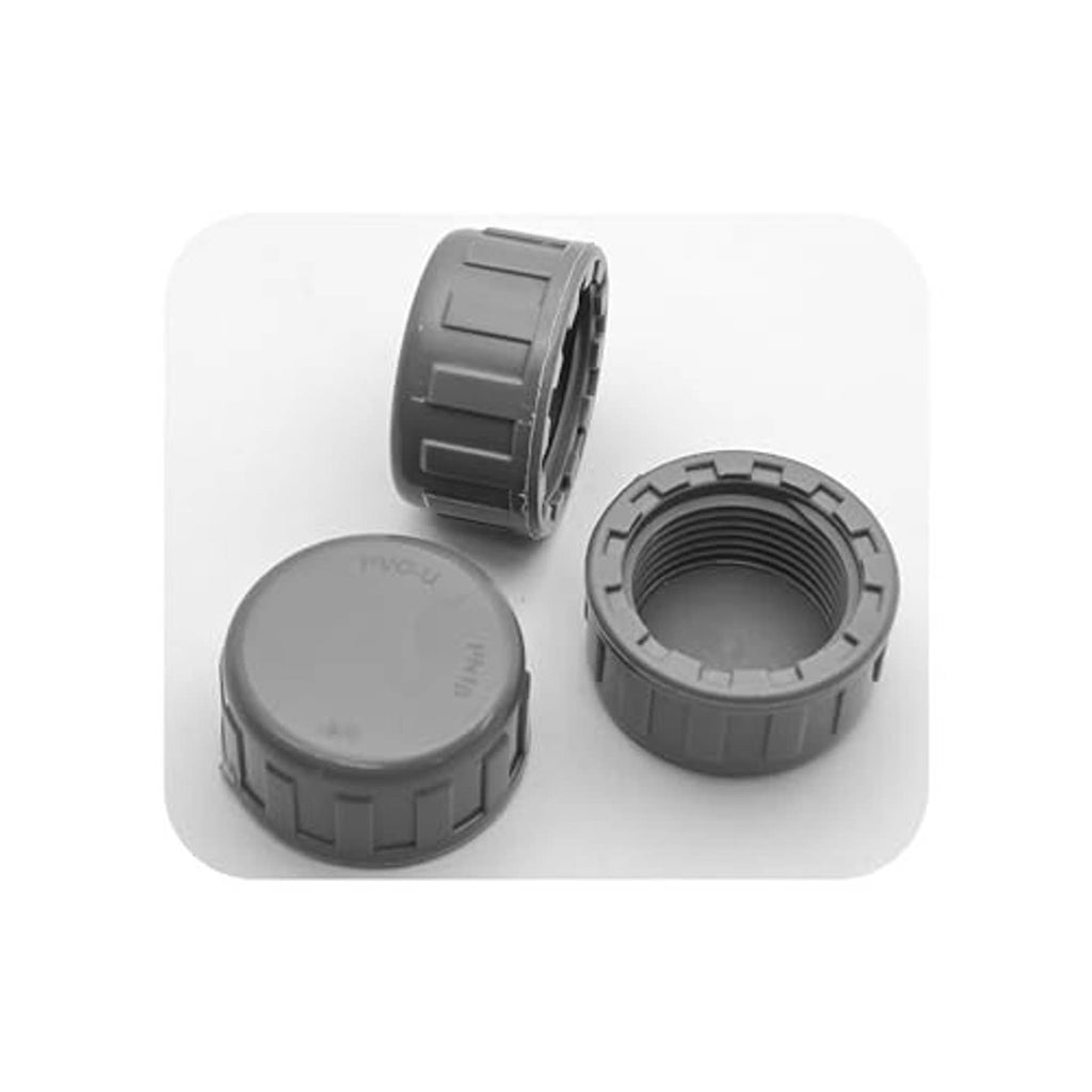 Gray PVC pipe end cap plug set showing round tops and threaded female openings