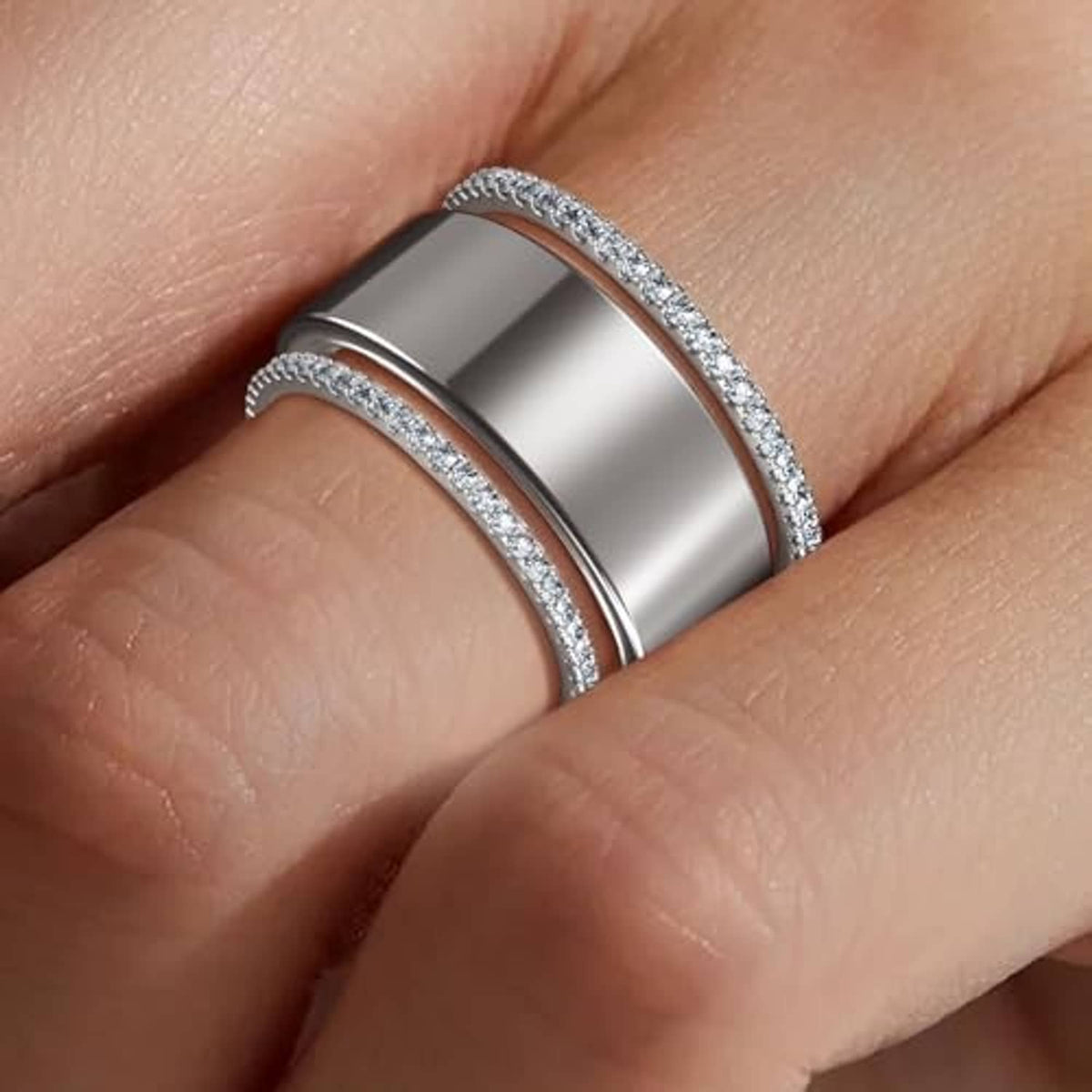 Stacking ring with polished silver center and glittered edges on a finger