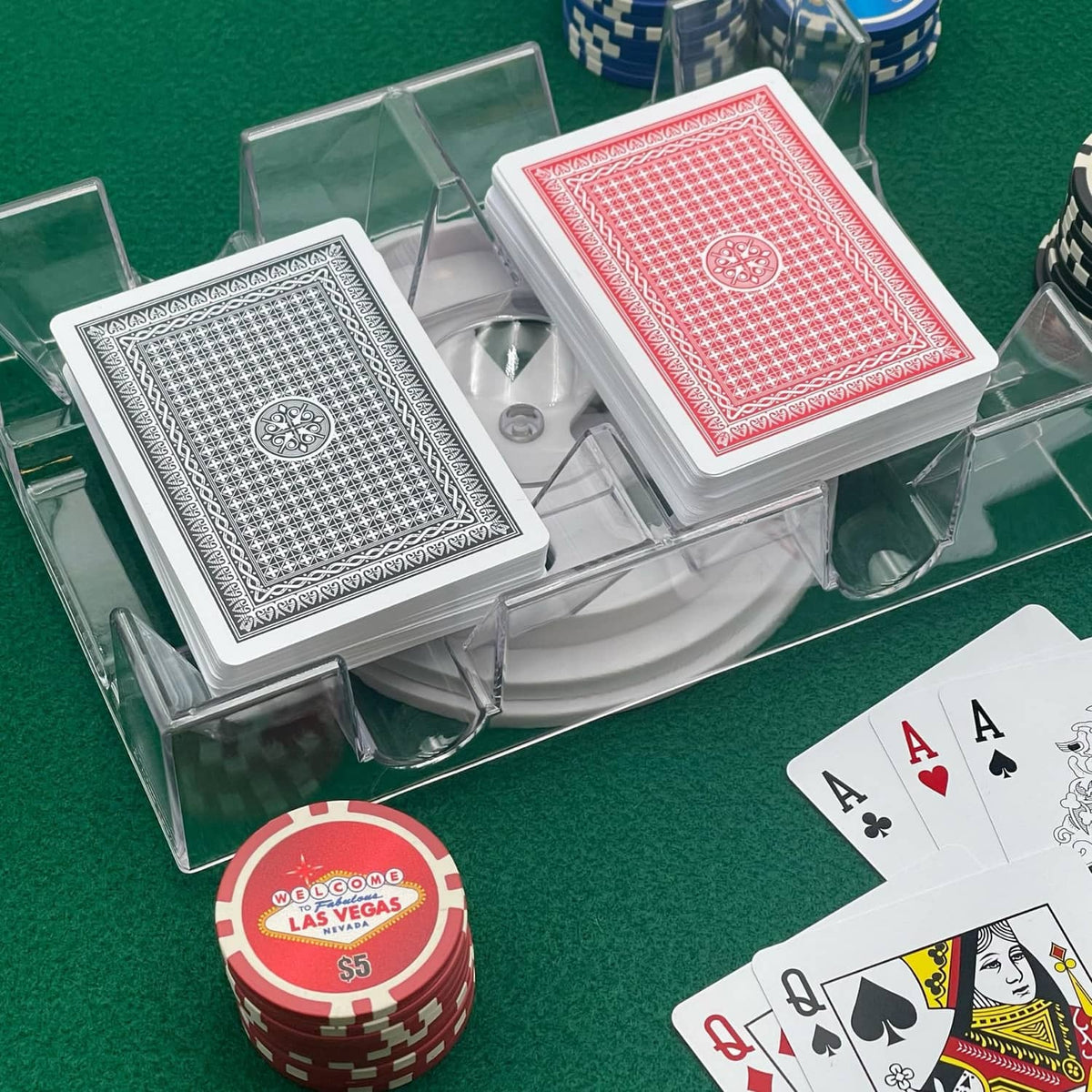 Clear dual-deck revolving card holder with red and black card decks and side clamps