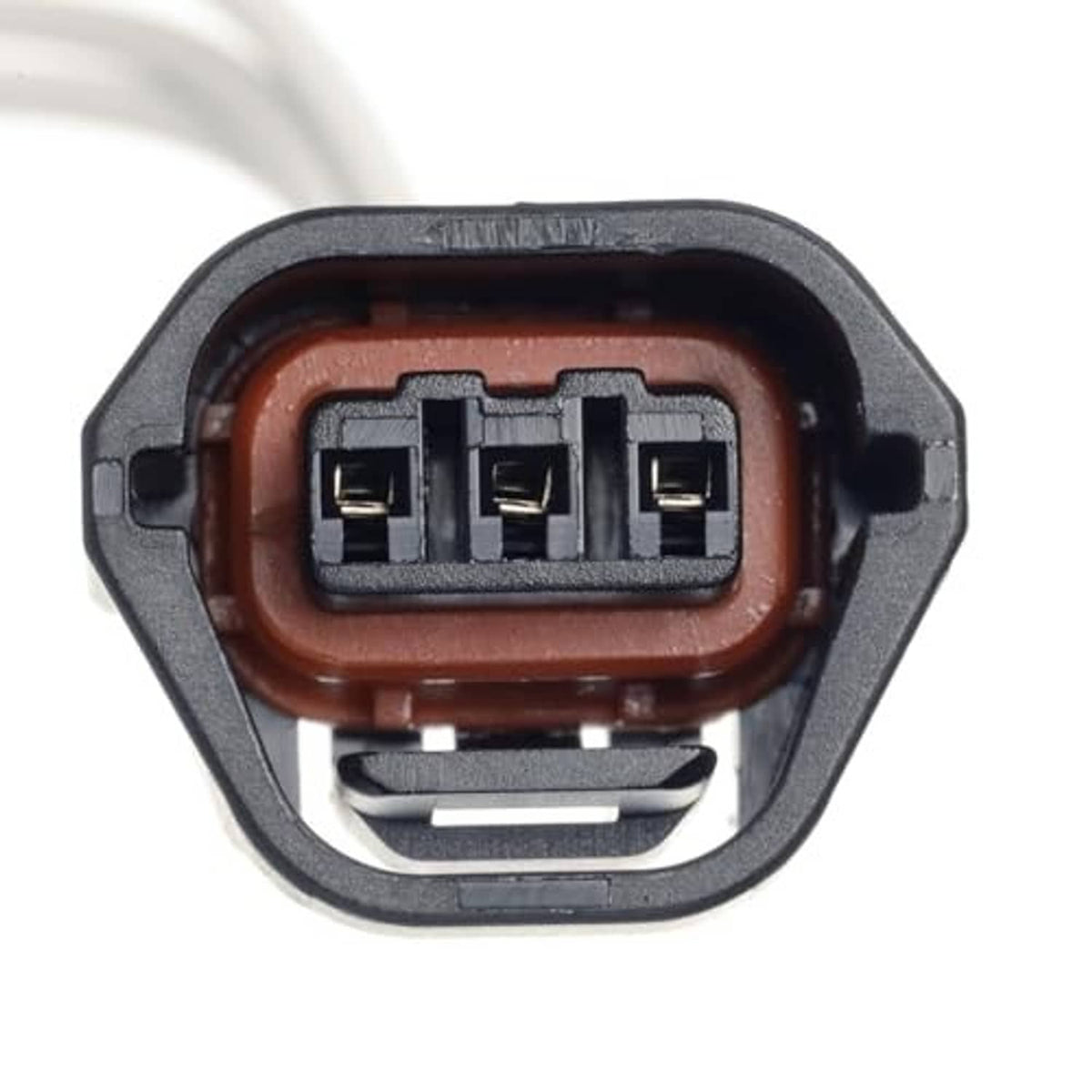 Three-pin camshaft sensor connector inside molded gray housing with brown wire collar
