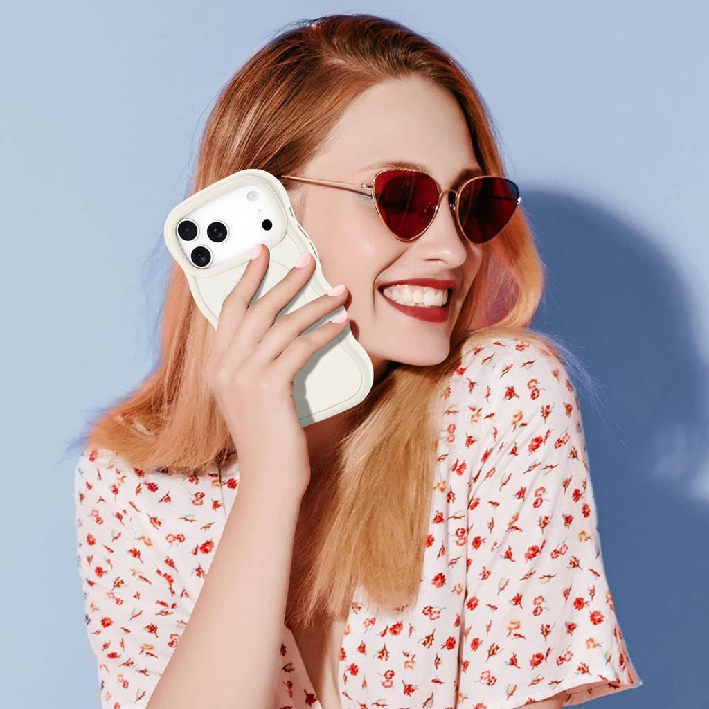 Stone cream iPhone case held in hand, showing camera cutouts
