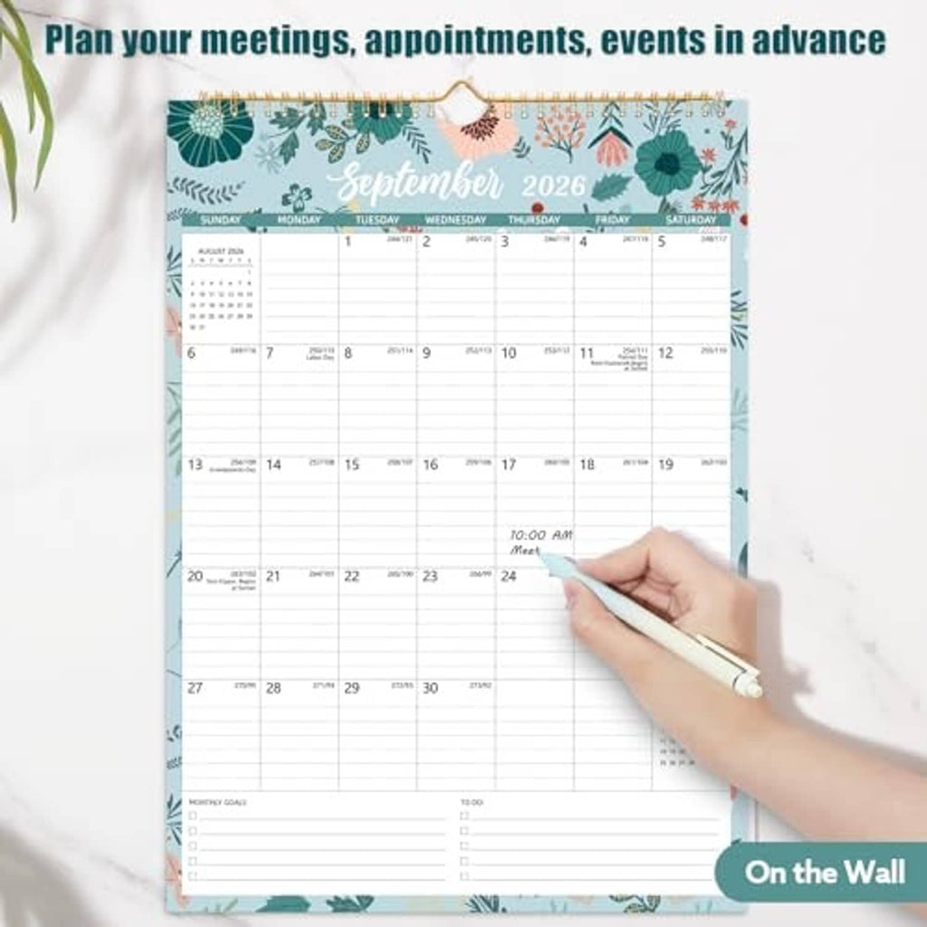 Floral wall calendar showing September 2026, with daily grid and hand writing