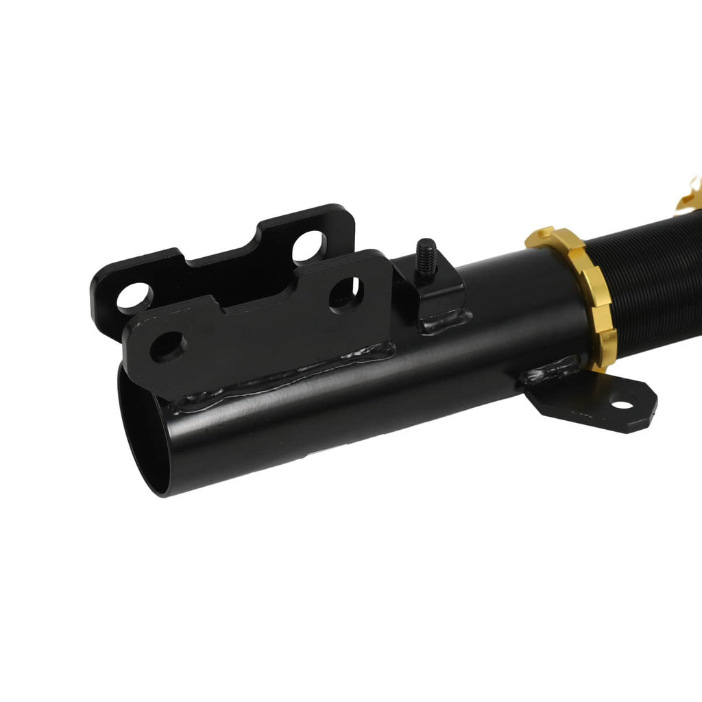 Black coilover strut body with mounting bracket and bolt holes, gold collar visible