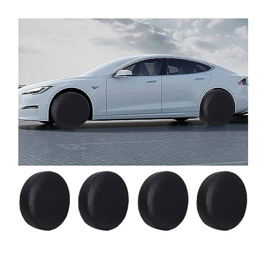 Four black tire covers laid out, round wheel cover design