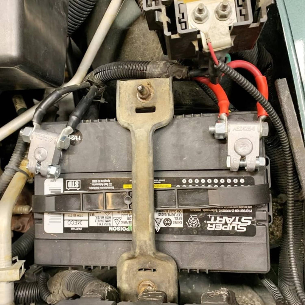 Installed battery top-post terminal end bracket with attached cable connections