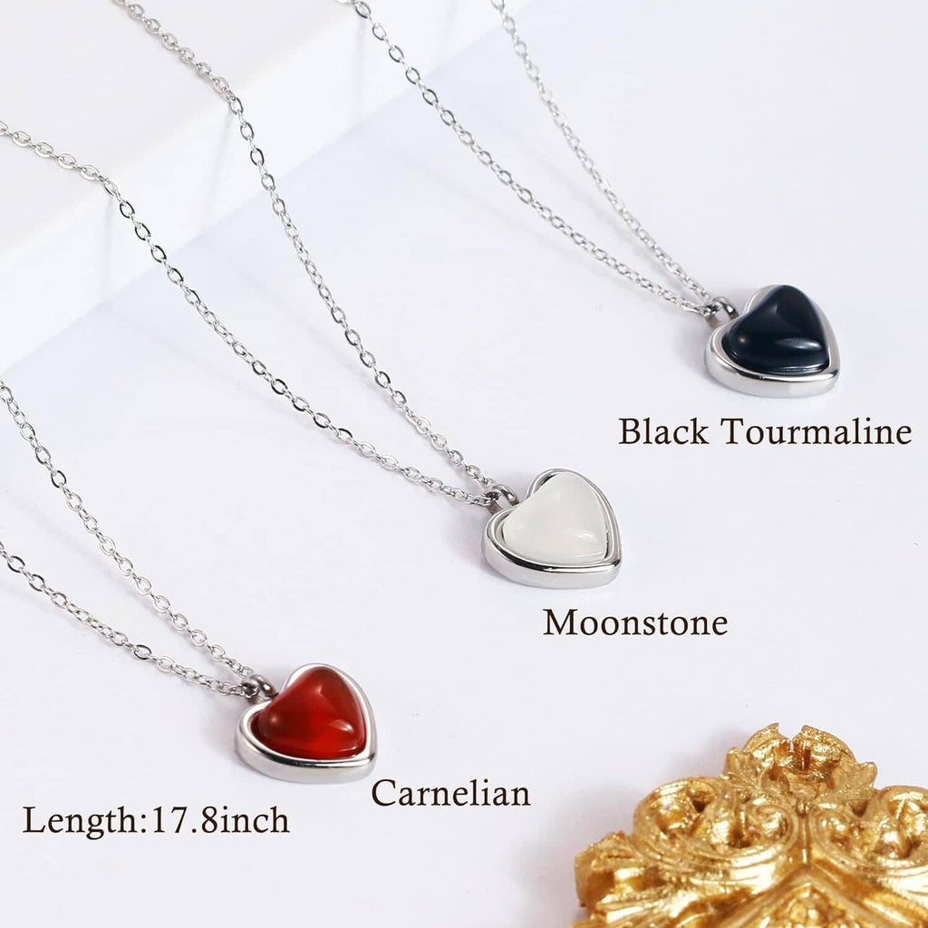 Silver chain necklace set with red carnelian heart pendant and other heart stones