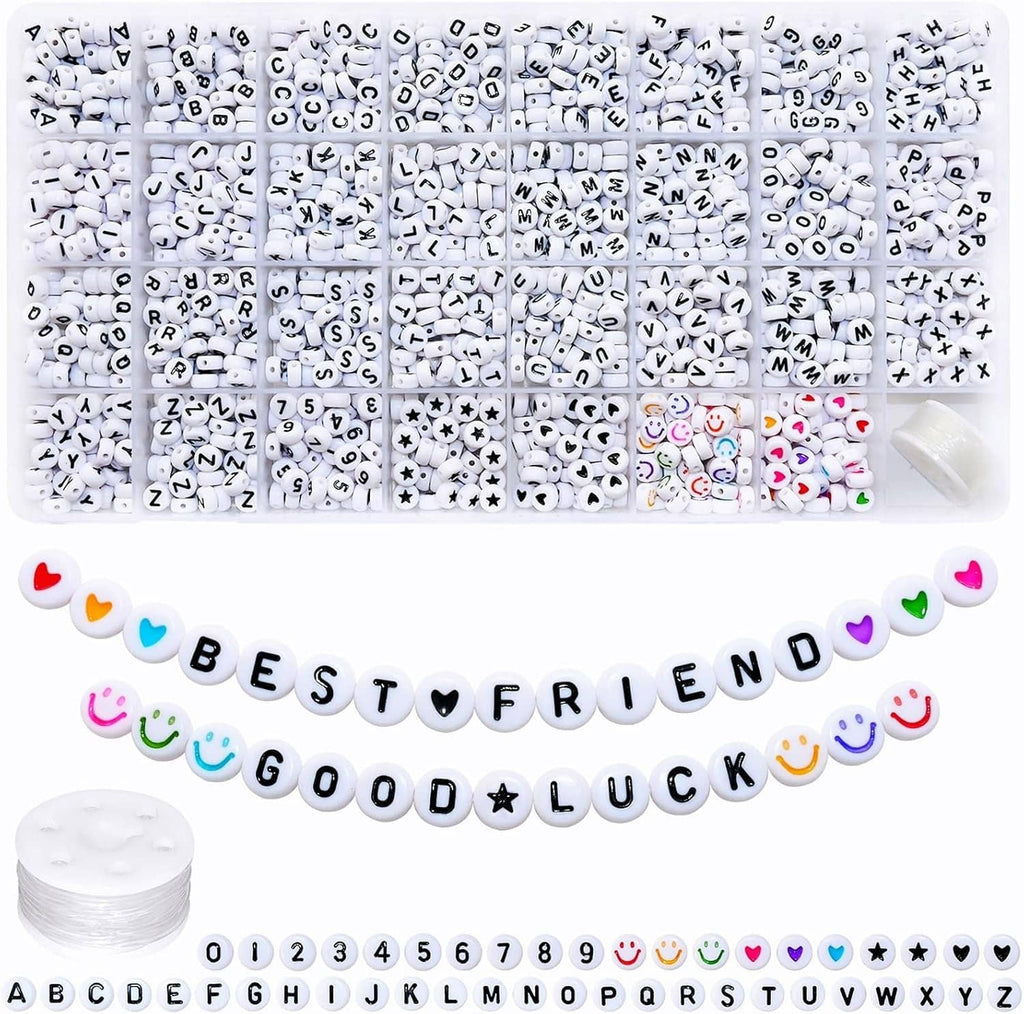 Assorted white acrylic alphabet, number, star, heart letter beads in a divided organizer