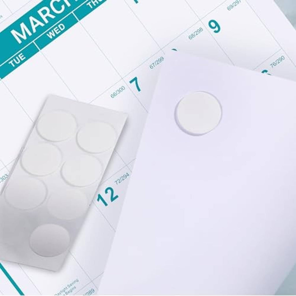 Close-up of March calendar page with teal day bars and blank circular stickers