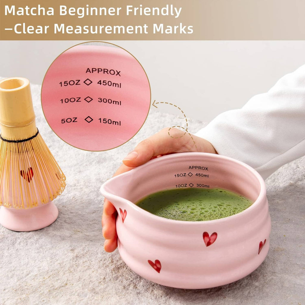 Pink ceramic matcha bowl with spout, filled with green matcha