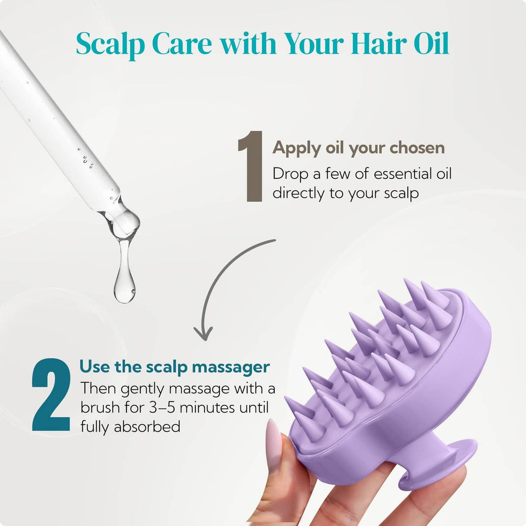 Purple scalp massager brush in hand with silicone spikes for applying scalp oil.
