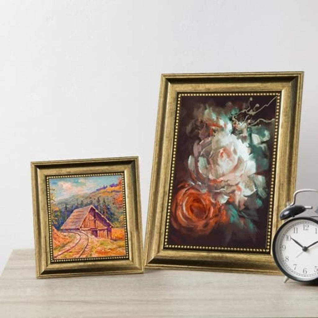 Ornate gold 5x7 picture frames with real glass, two framed artworks