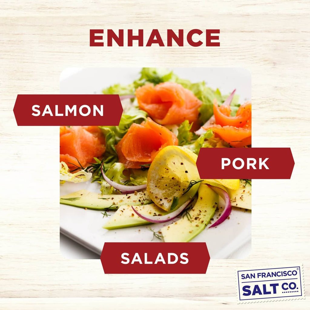 Cherrywood smoked sea salt fine grain seasoning shown with salmon, pork, and salads