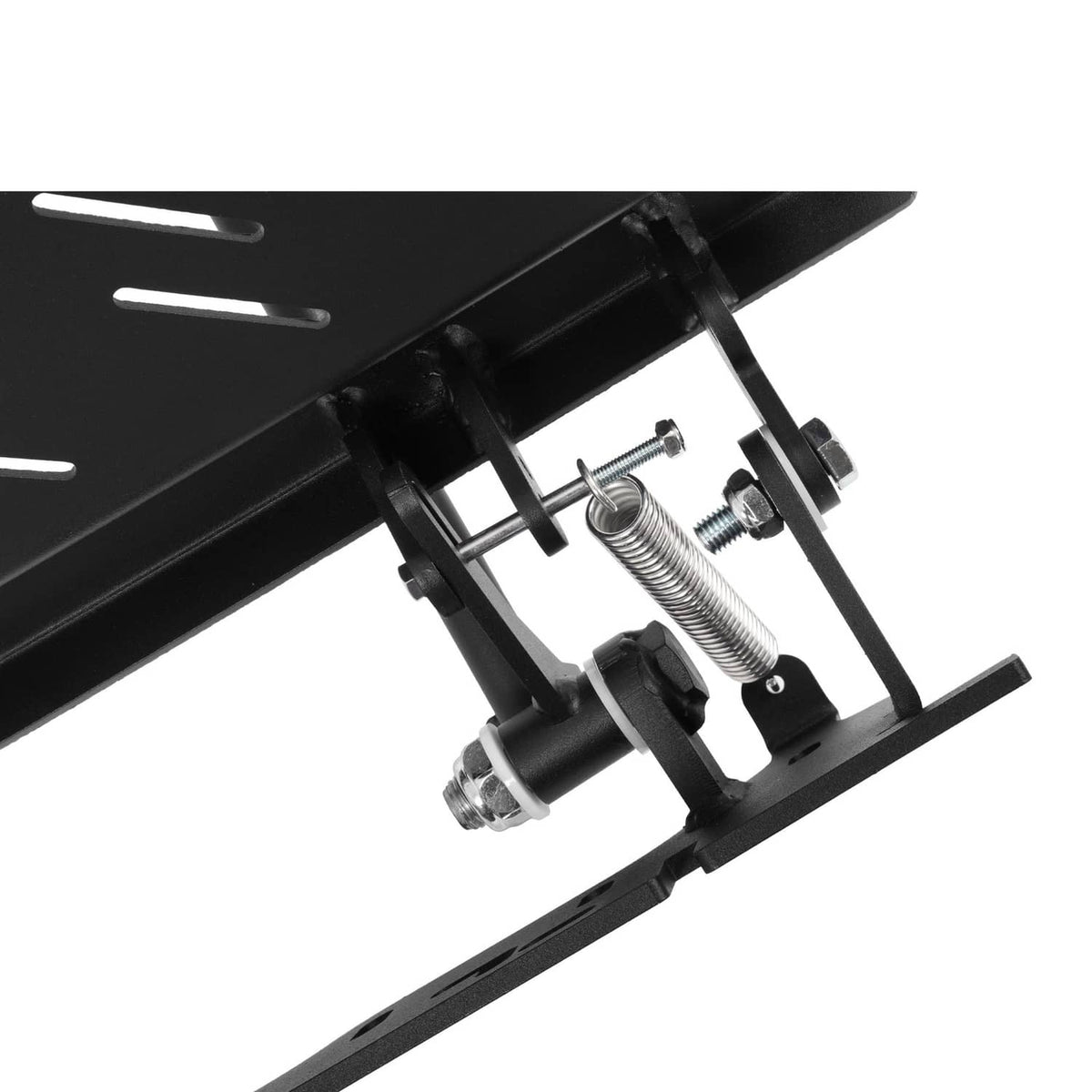 Underside view of chute blocker with springs, bolts, and pivot mounting hardware