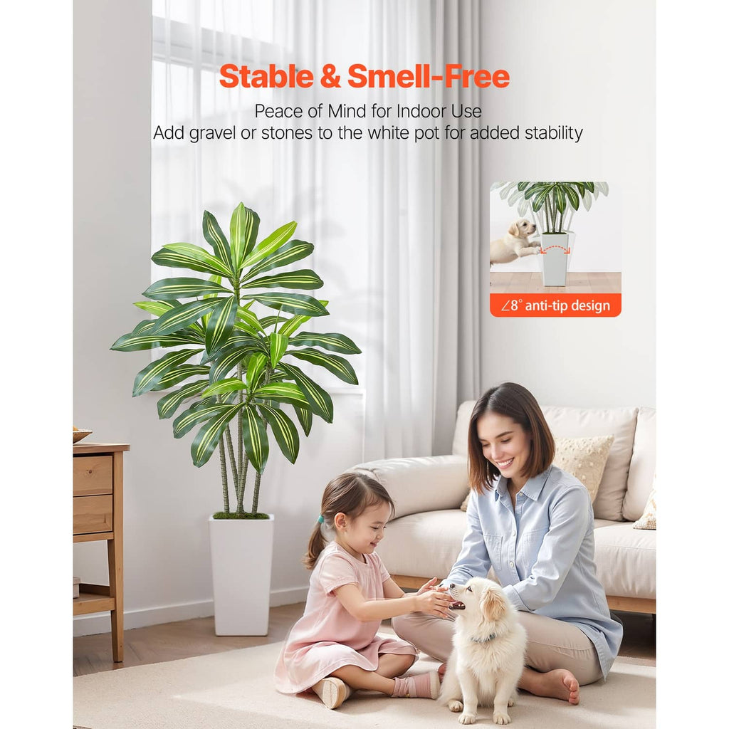 Faux dracaena tree with bright green leaves in a white pot for indoor decor